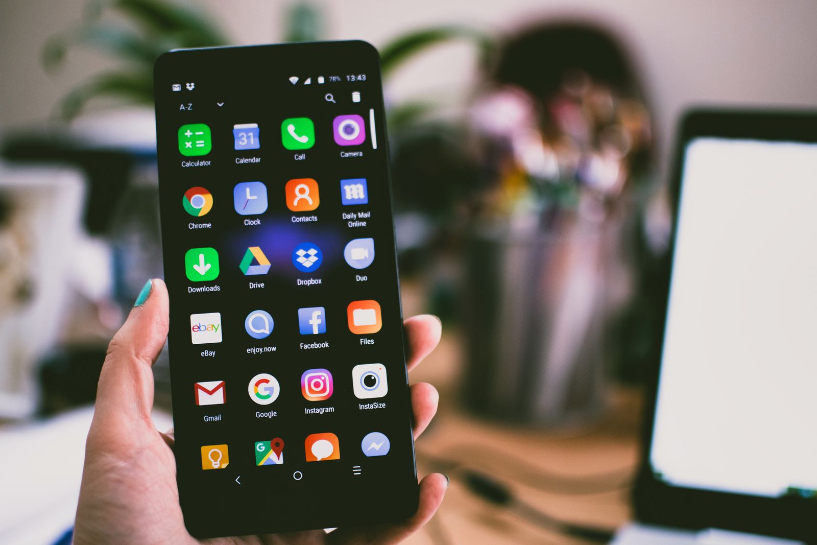 Hands holding an iPhone — Photo via Pexels