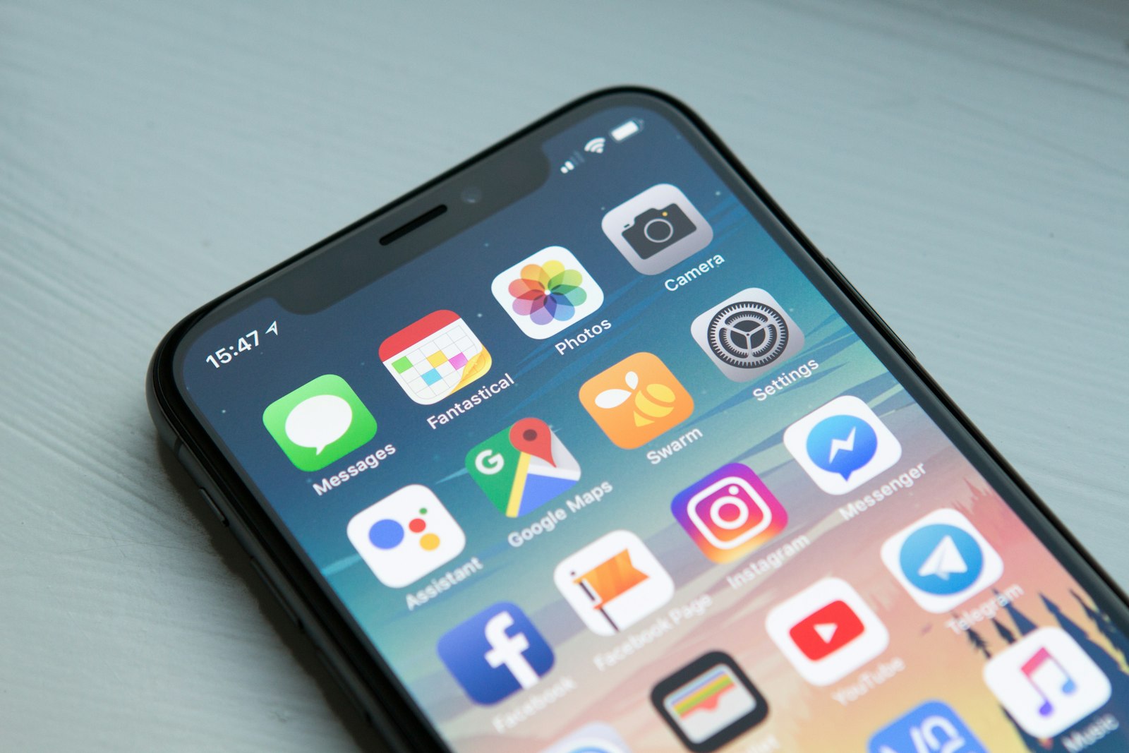 Space gray iPhone on a desk — Photo by William Hook on Unsplash